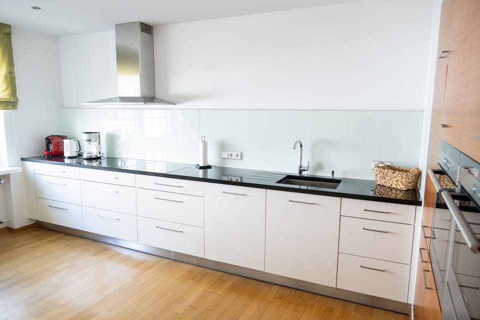 Deluxe Apartment, Private Bathroom | Private kitchen | Highchair