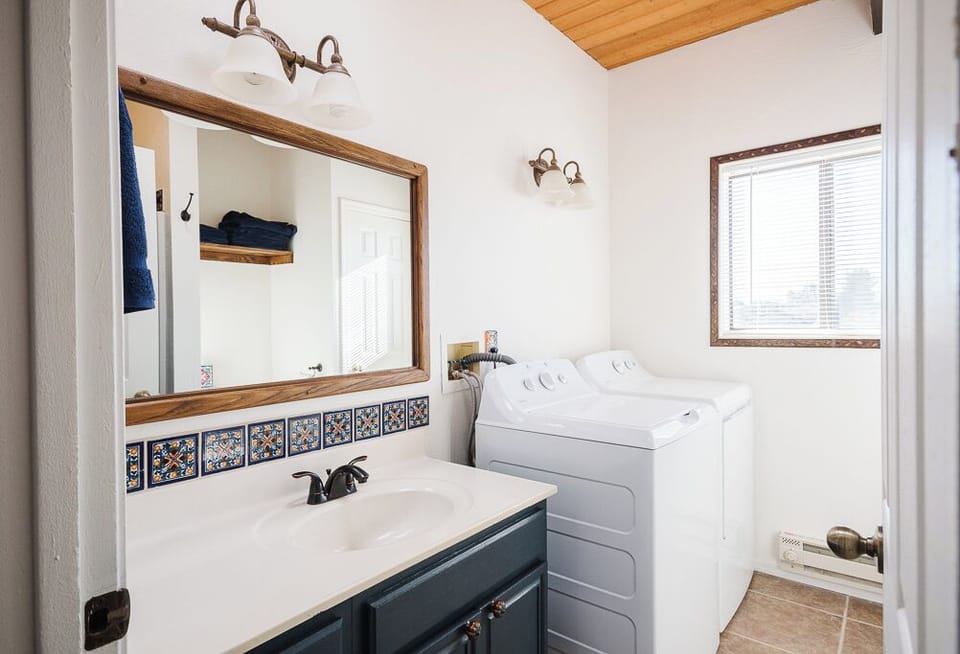 Unit B: Bathroom & Laundry w/ walk-in shower, toilet