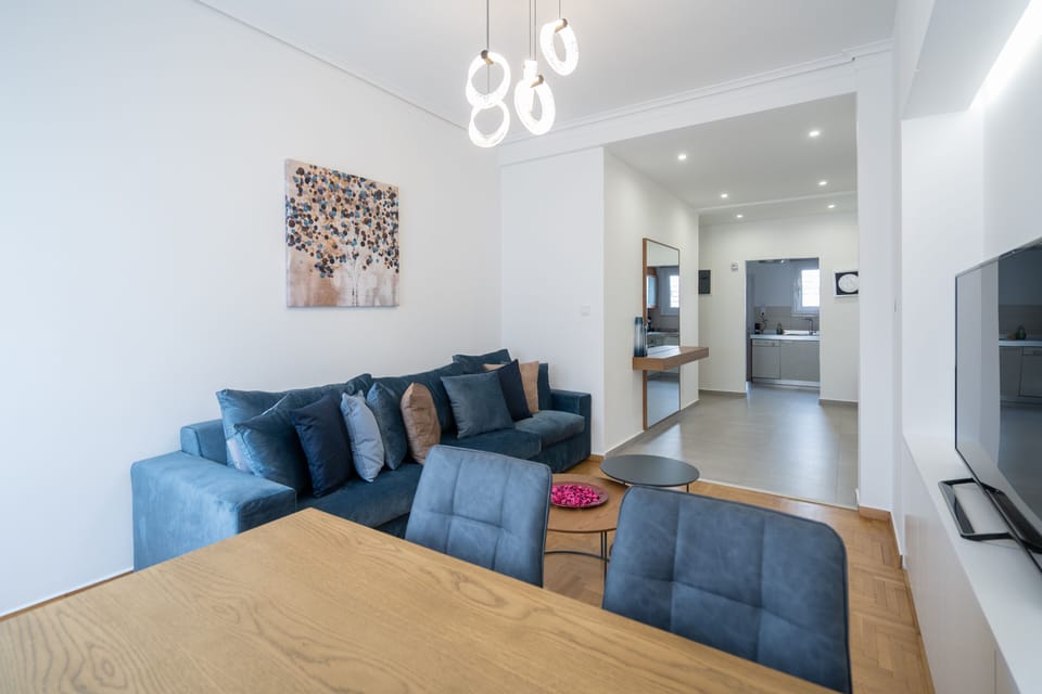 Design Apartment, City View | Living area | 62-inch Smart TV with cable channels, TV