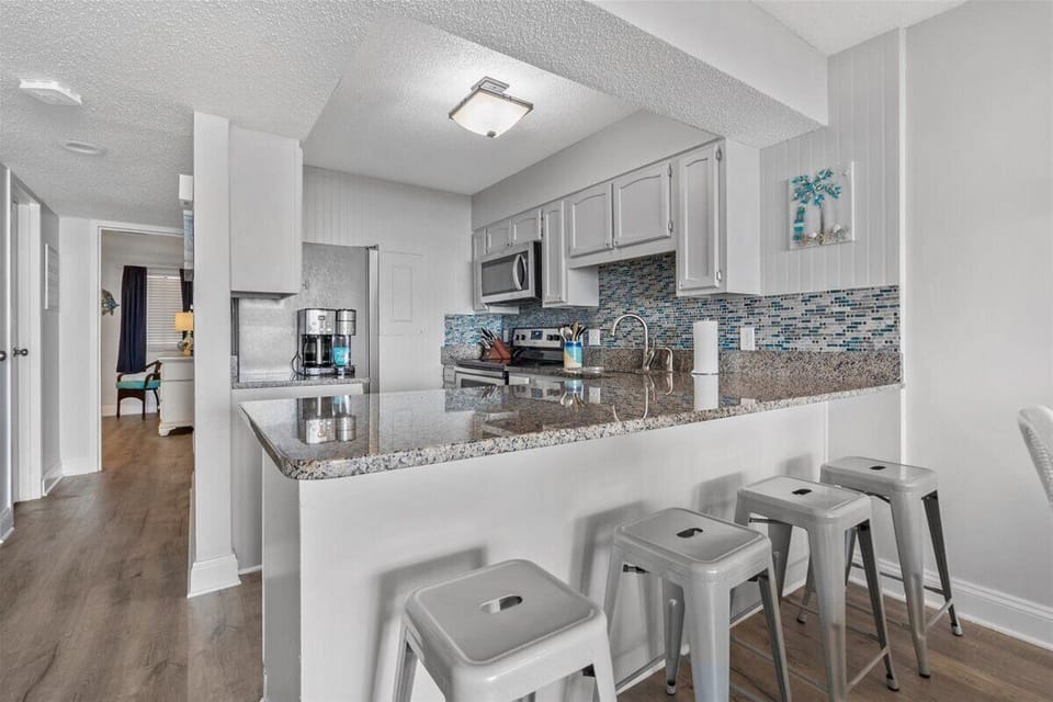 New paint and floors throughout as well as painted cabinets with new hardware