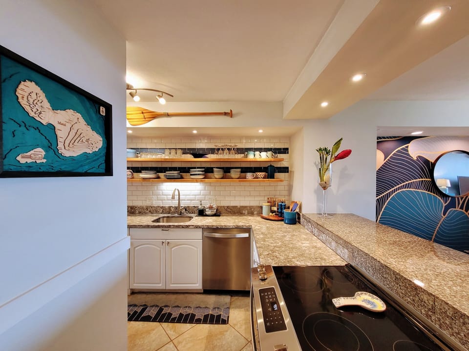 Stainless steel appliances, open shelving and loads of kitchen tools