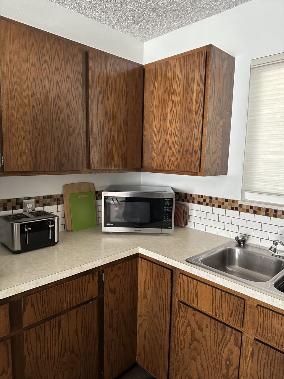 Kitchen is fully stocked with silverware, cups, dishes, pots/pans, and toaster.