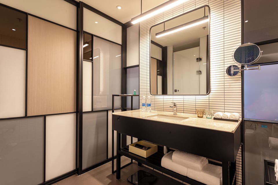 Breezy, Room, 2 Double Beds, City View | Bathroom | Free toiletries, hair dryer, slippers, towels