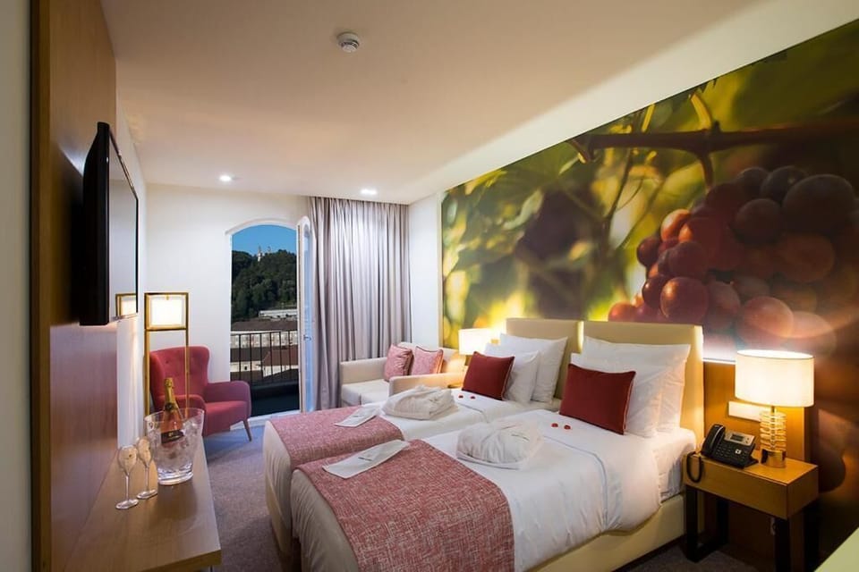 Superior Twin Room | Minibar, in-room safe, desk, laptop workspace