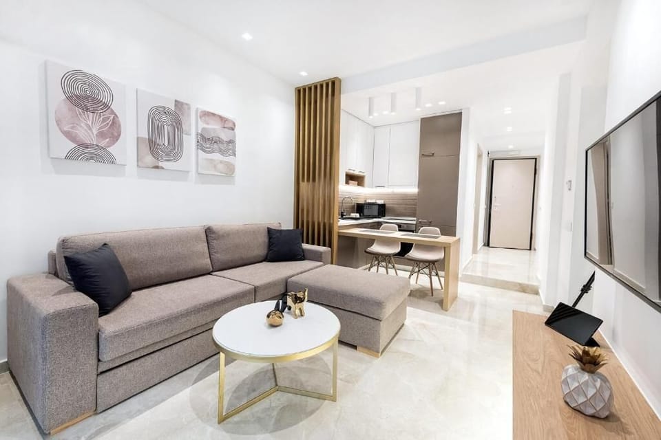 Deluxe Apartment | Living area | 45-inch Smart TV with digital channels, tablet