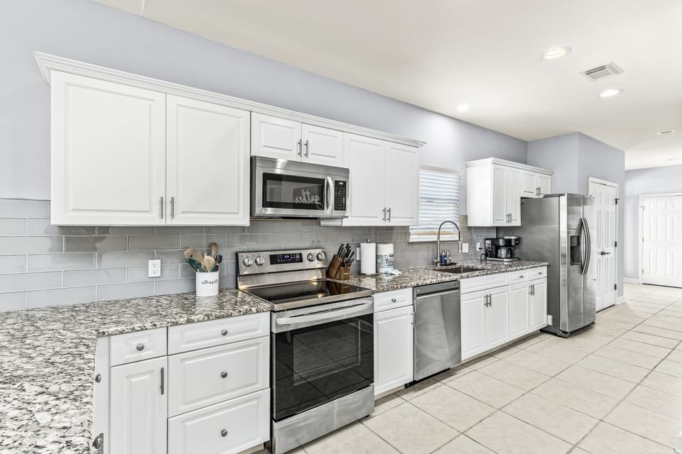 Stainless steel appliances, backsplash in the kitchen