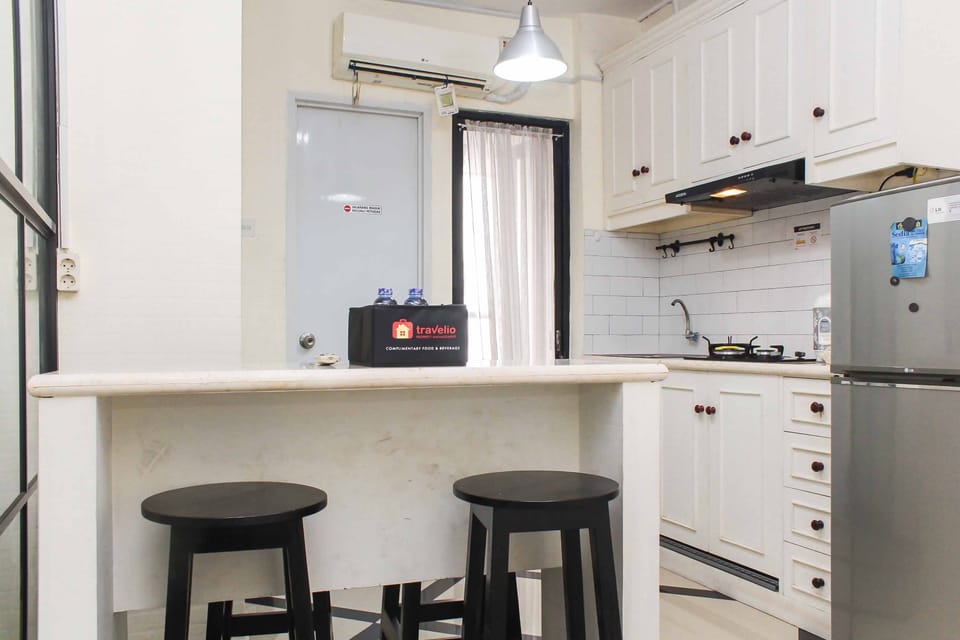 Fridge, stovetop, cookware/dishes/utensils, dining tables