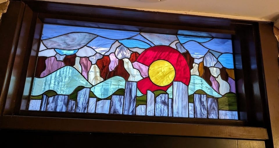 custom Denver skyline stained glass piece (above front door)