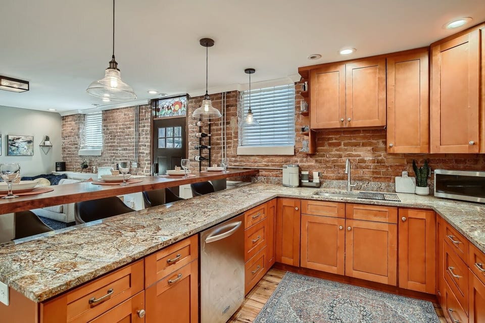 large kitchen with plenty of counter space & various cooking amenities