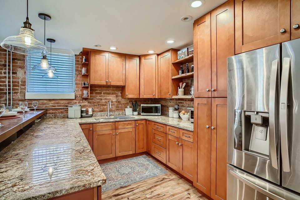 large kitchen with plenty of counter space & various cooking amenities