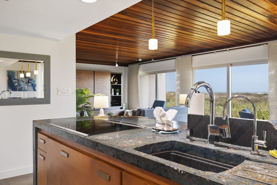 The kitchen features beautiful custom made countertops!
