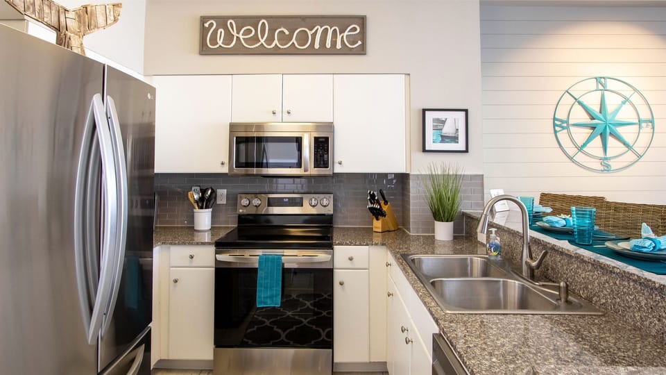 Fully stocked kitchen including Keurig and drip coffee makers.