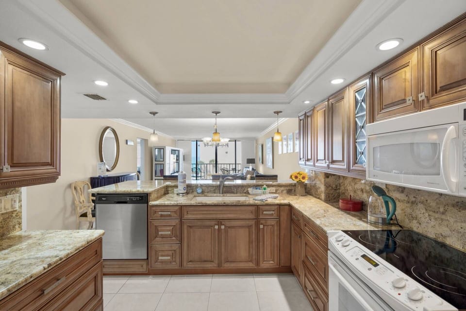 Large kitchen includes small appliances. Stocked with dishes, glasses and basic needs. No food items.