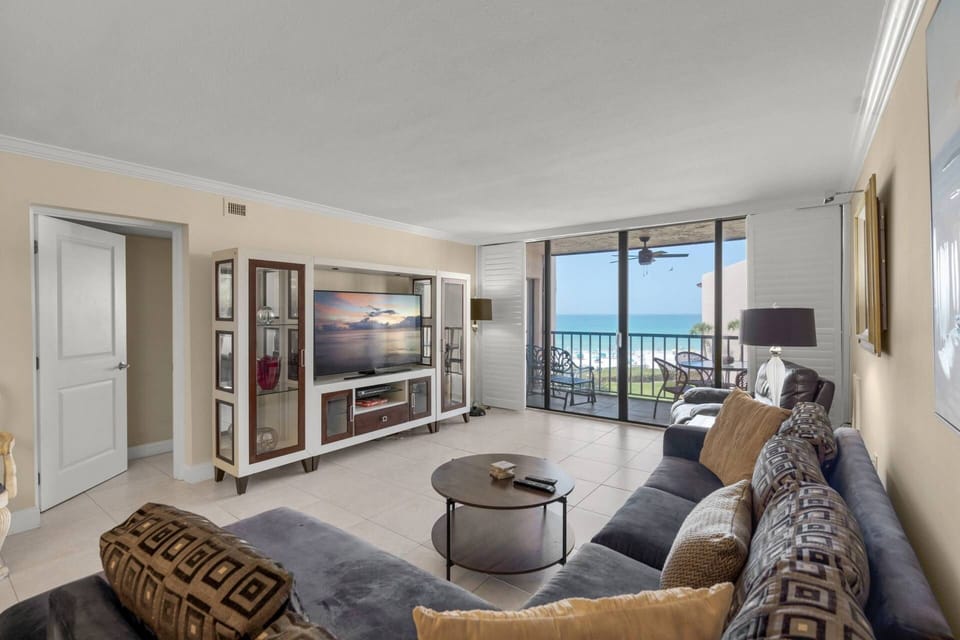 Bright and beautiful living room with corner sofa with views of the water!