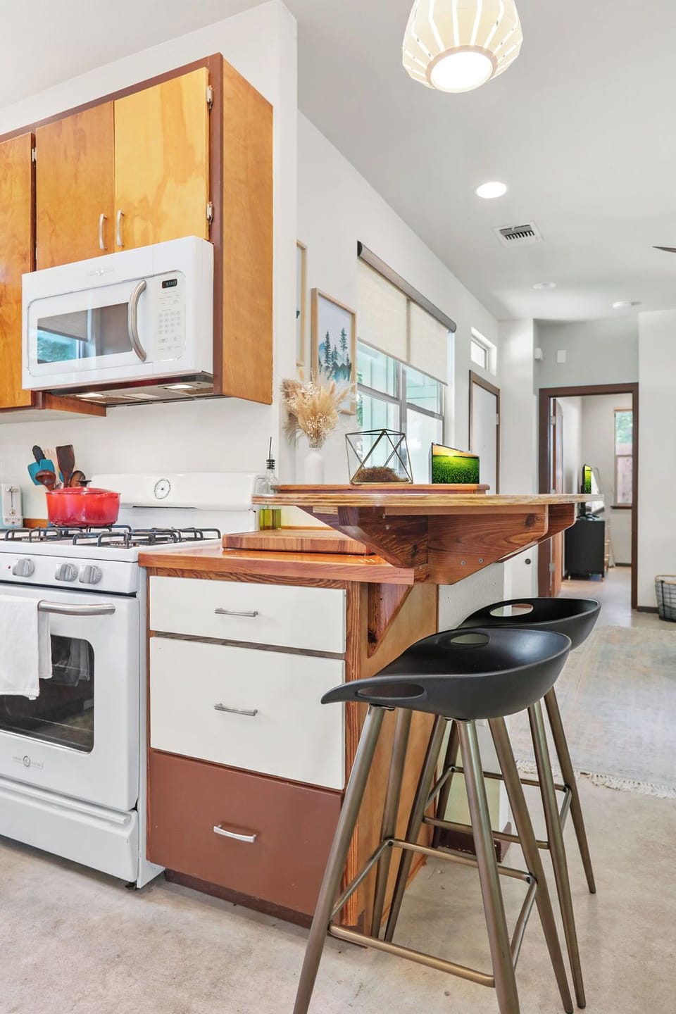 Kitchen with coffee maker, coffee beans included, blender, toaster, etc.