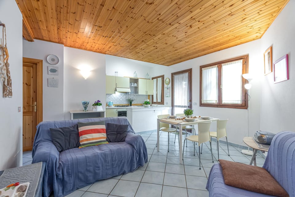 Family Apartment, 1 Bedroom, Terrace (Blue&Green House With Shared Pool) | Living area | 21-inch TV with digital channels
