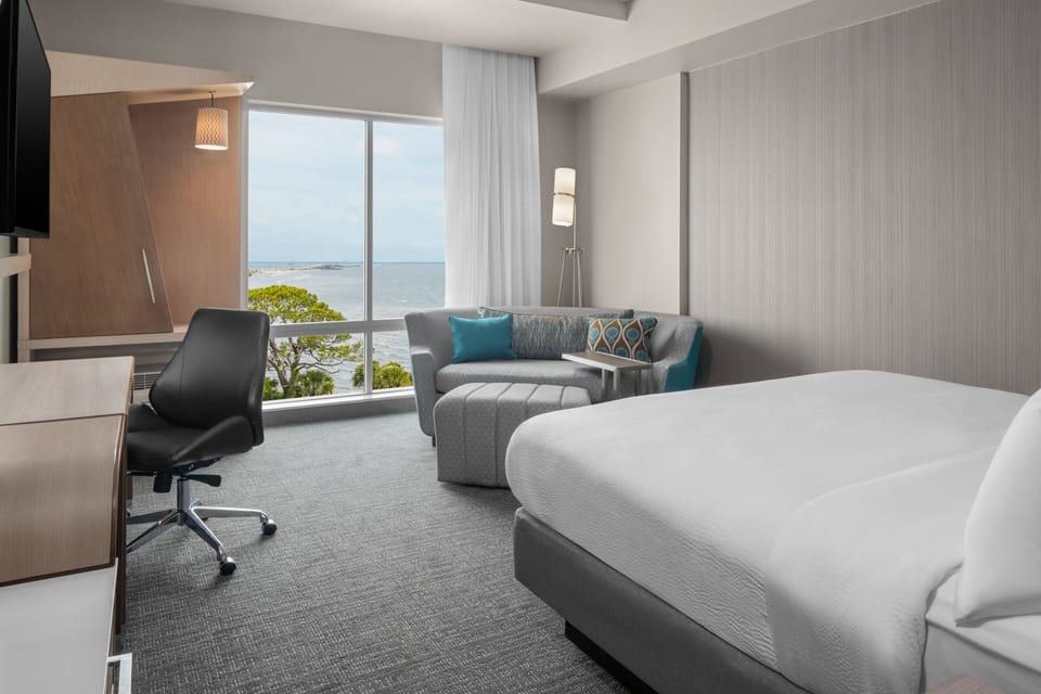 Room, 1 King Bed with Sofa bed, River View | Desk, laptop workspace, iron/ironing board, free cribs/infant beds