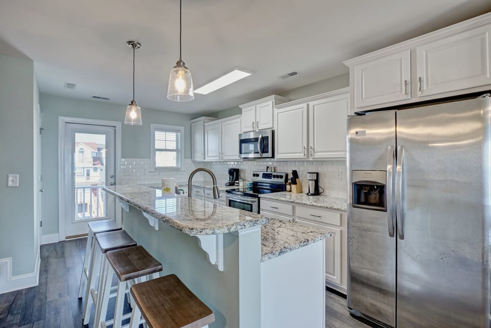 Gourmet kitchen w/ granite and stainless steel appliances