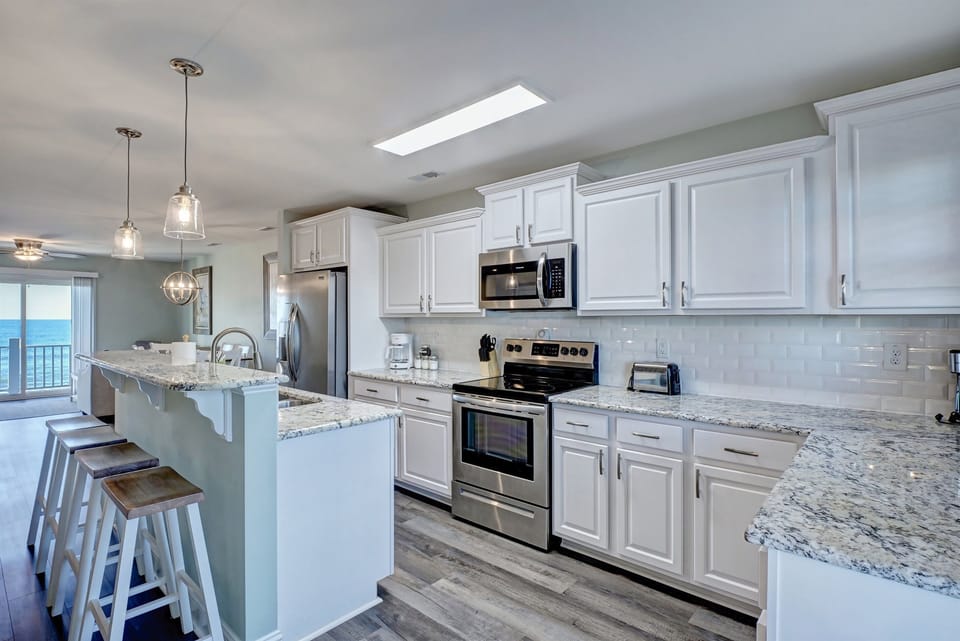 Gourmet kitchen with granite and stainless steel appliances