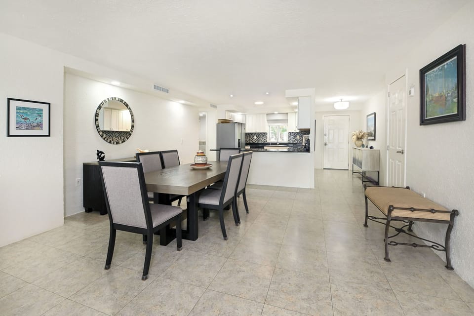 Gather around your elegant dining table in this bright, open-concept space where memorable meals and conversations await.