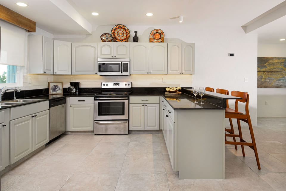 Keep your designated group chef company at the bar seating and spend quality time in our coastal condo!