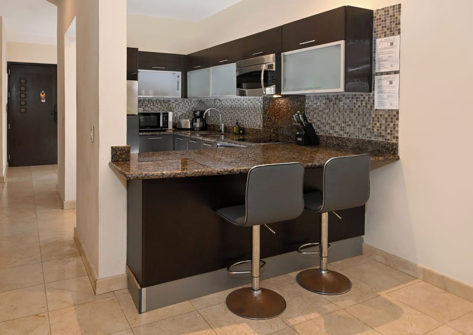 Your modern kitchen comes fully equipped with granite countertops, stainless steel appliances, and a breakfast bar where you can start your day with fresh coffee.