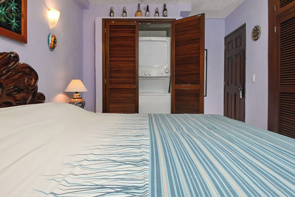 Bedroom with comfy linens, A/C and ceiling fan