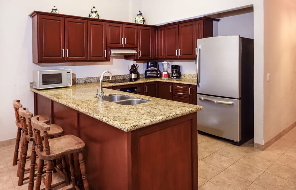 Fully-equipped kitchen with custom finishes
