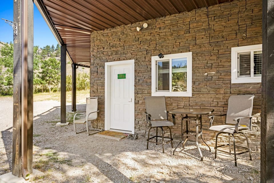 Entrance and outdoor seating area to Studio on 1st floor of house. 