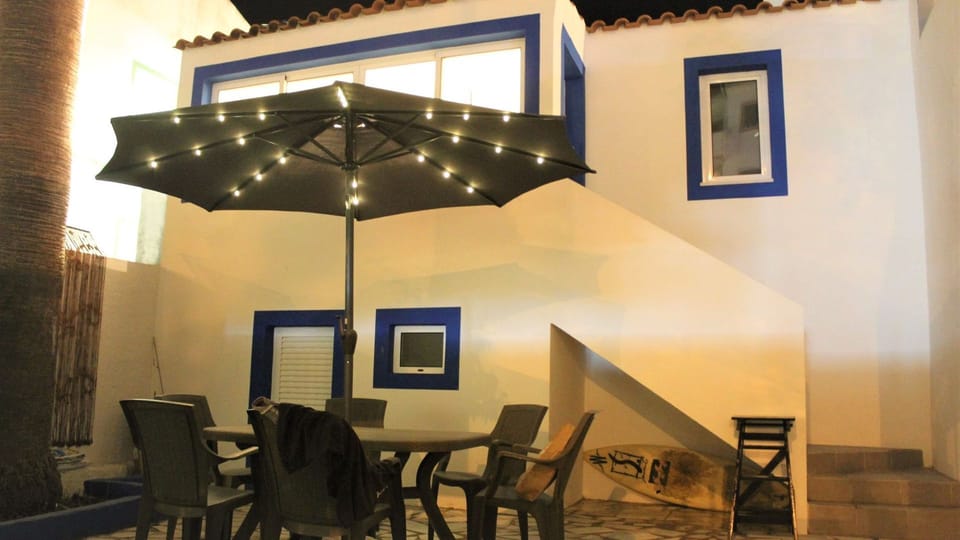 Enjoy alfresco dining under the warm glow of string lights, creating a magical evening ambiance on the charming patio.
#PatioDining #EveningVibes #LovelyStay