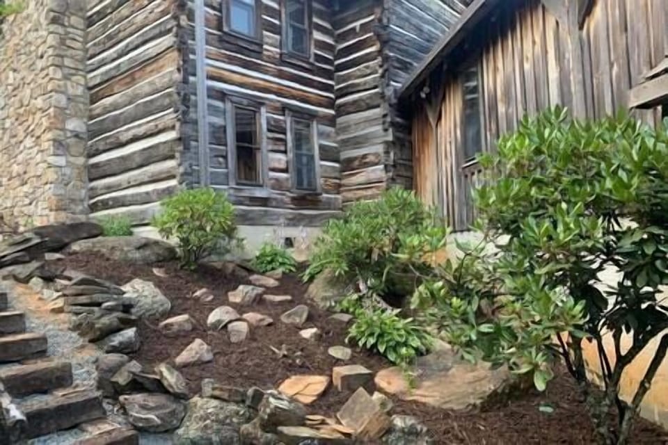 An exterior view of the enclosed breezeway leading up the main lodge. 
