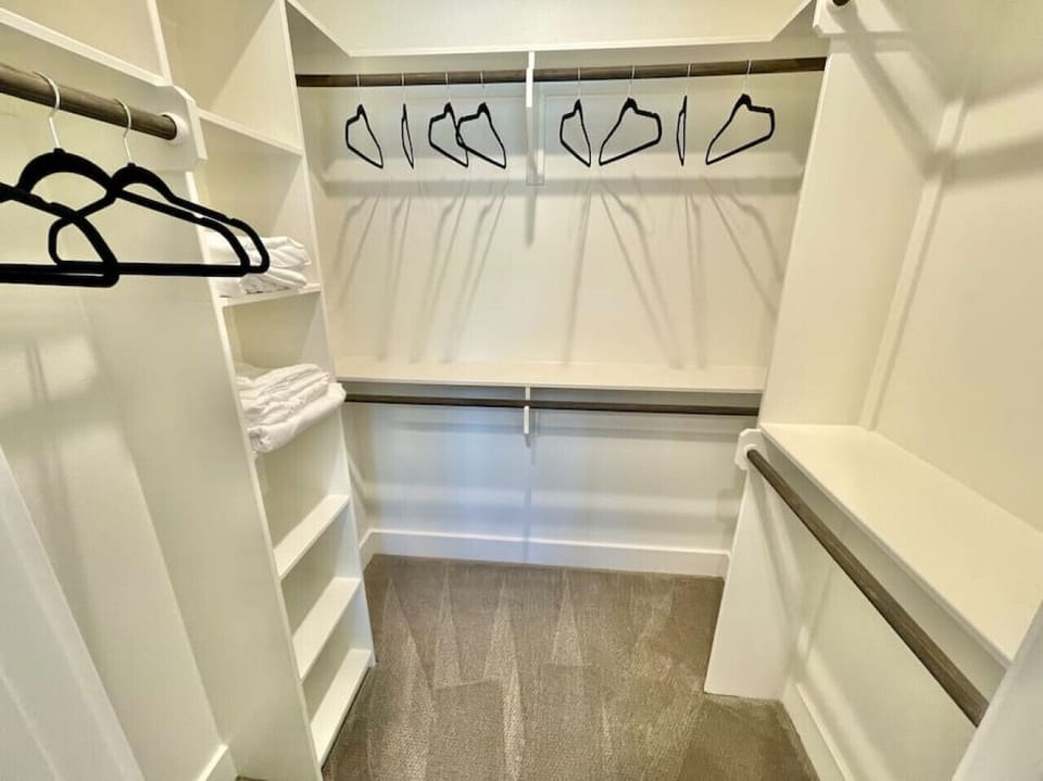 Each bedroom closet is a large walk in closet with lots of hangers!