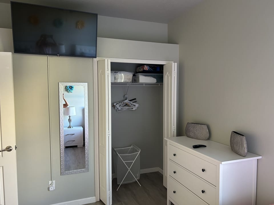 Queen bedroom #2 closet and smart TV.