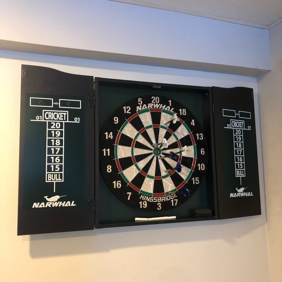 Dart board in lower level game room
