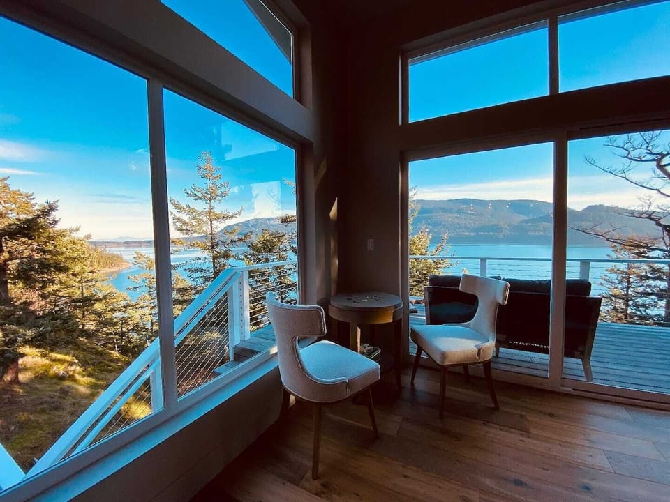 Water views with a puzzle table and outdoor seating.