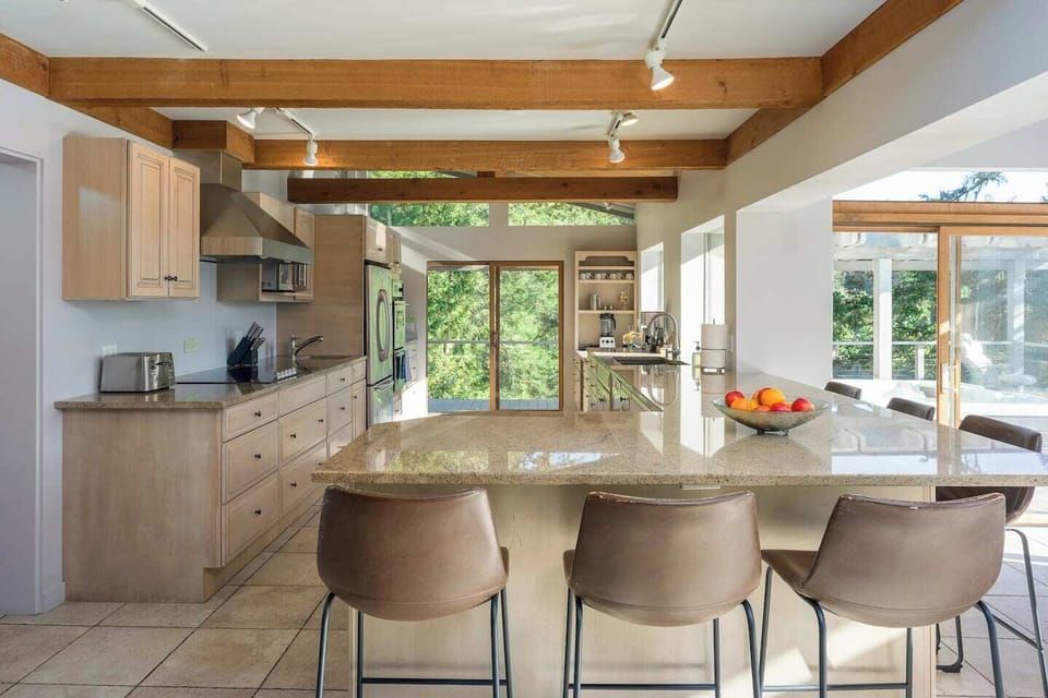 Spacious gourmet kitchen with counter dining for five.