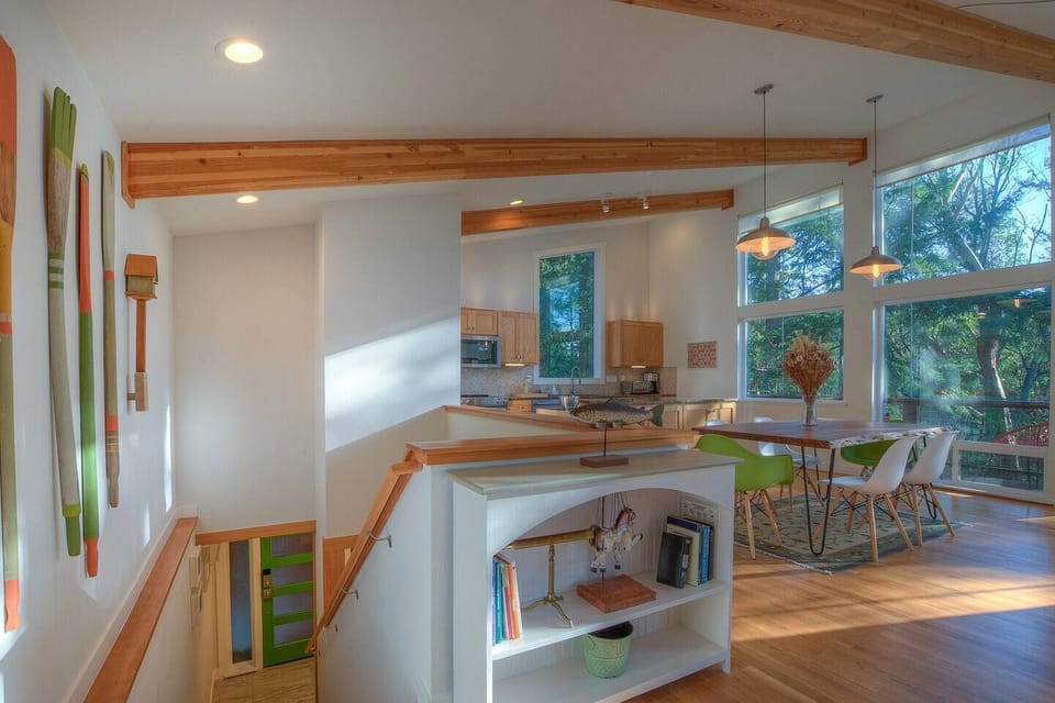 Stairs leading down to the front door and bedrooms below.