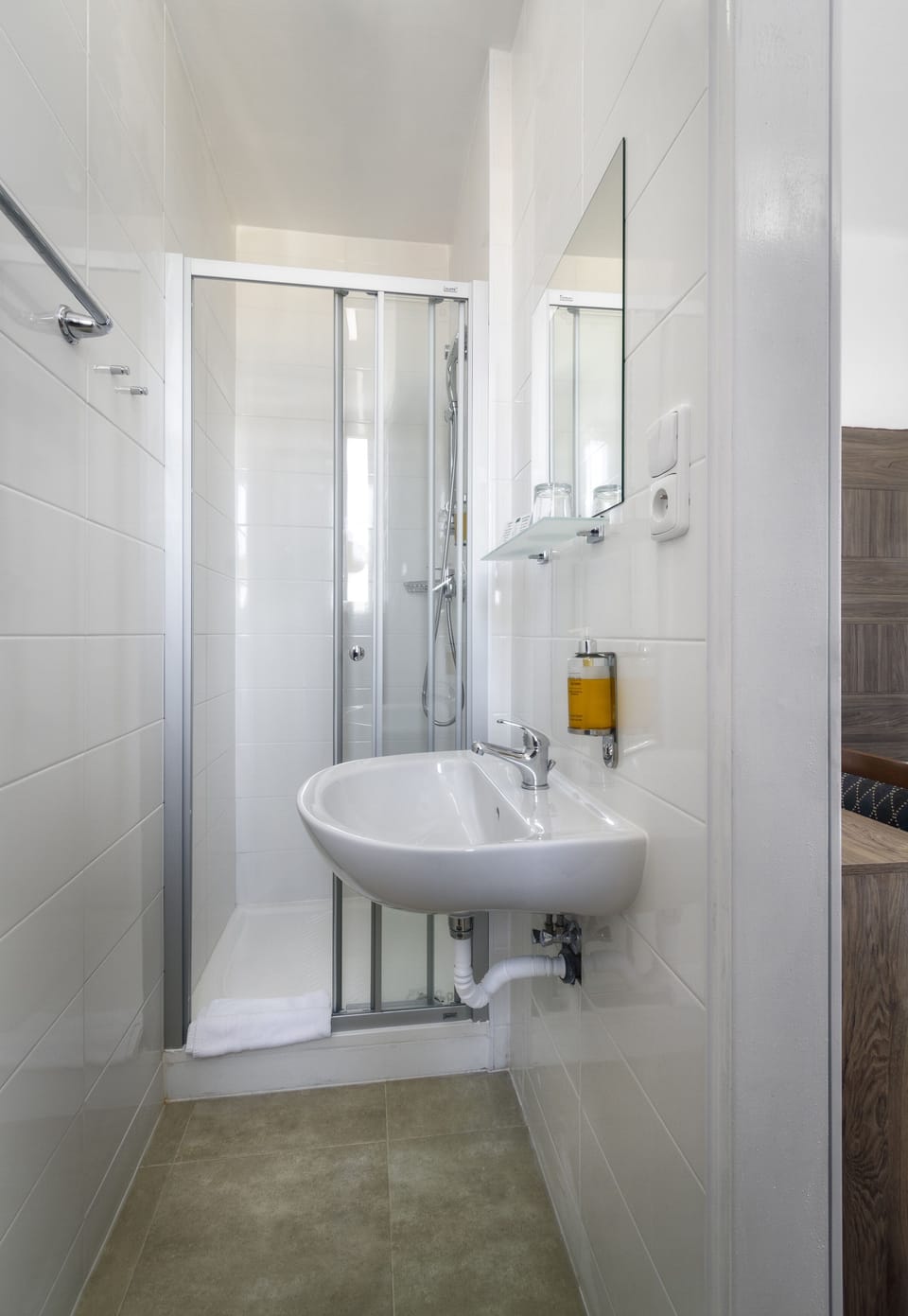 Economy Single Room, Courtyard View | Bathroom | Shower, eco-friendly toiletries, hair dryer, towels
