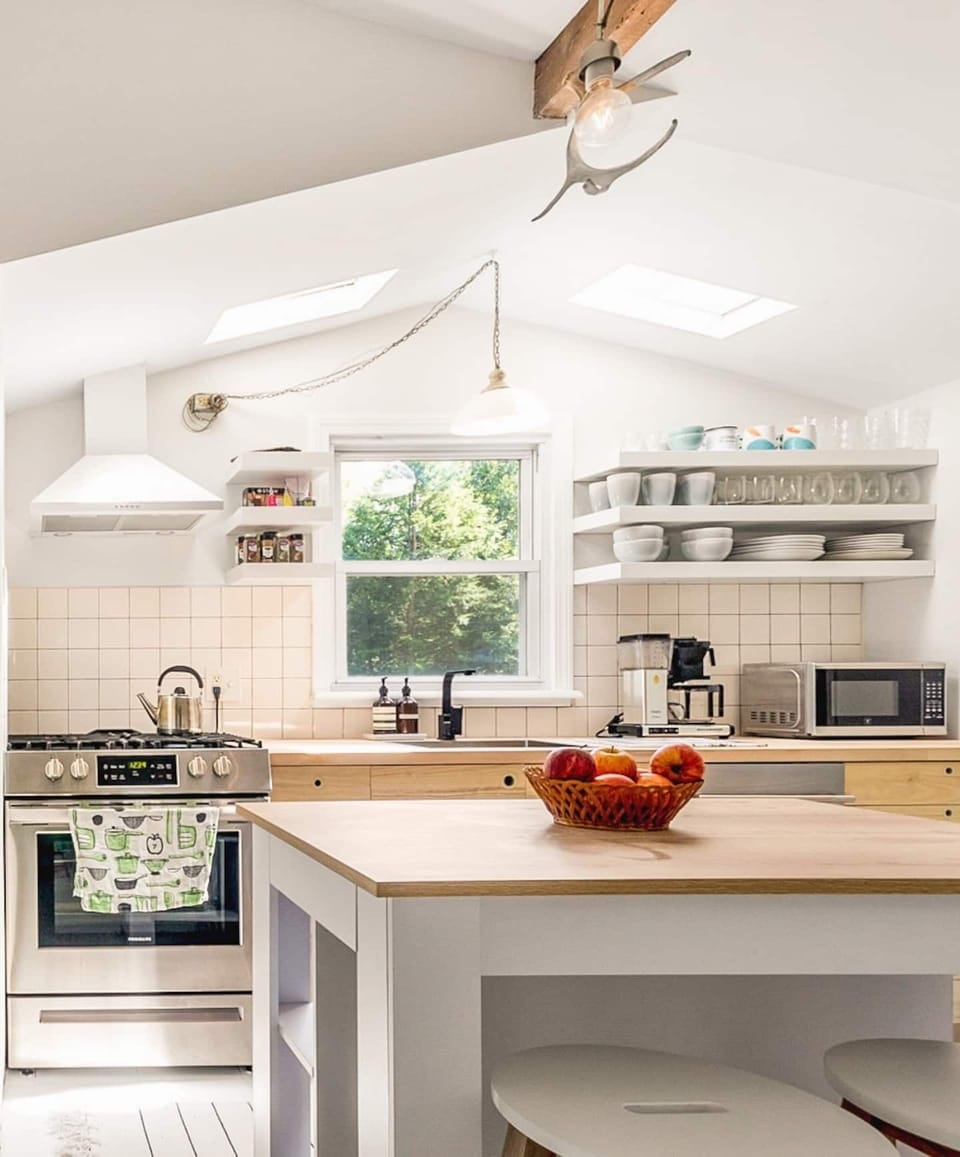 The roomy kitchen is fully stocked and was renovated in 2021.