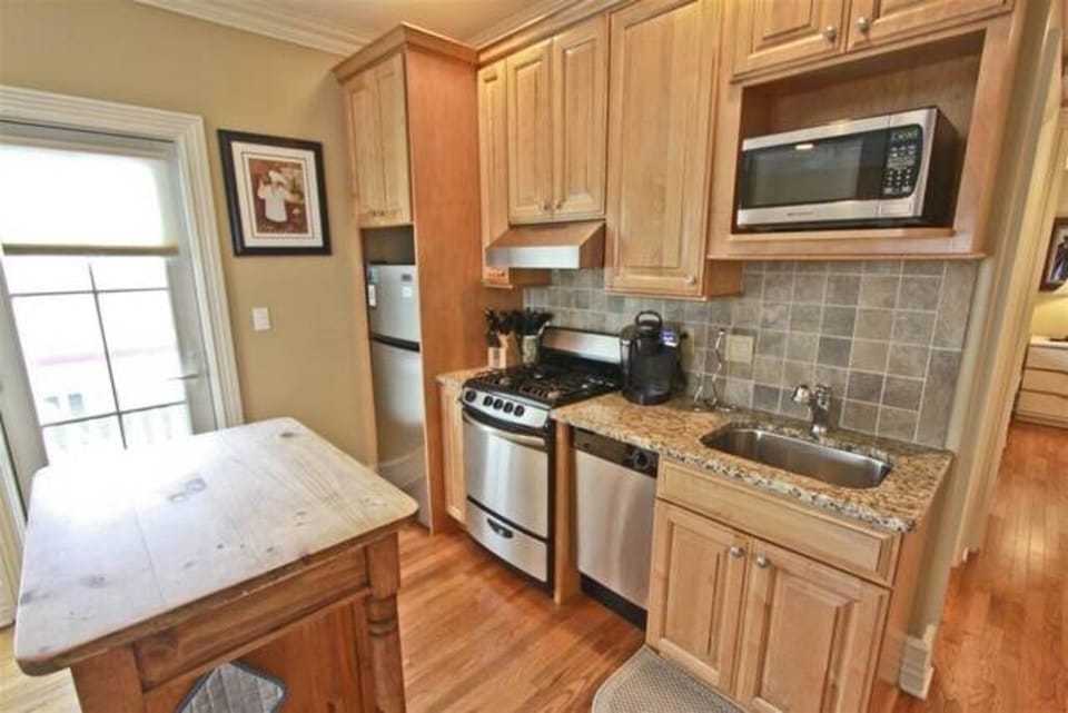 Kitchen with door leading to balcony