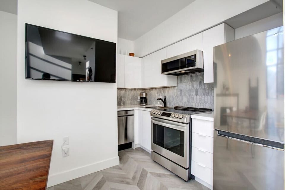Well equipped, sleek kitchen ready for you to use.