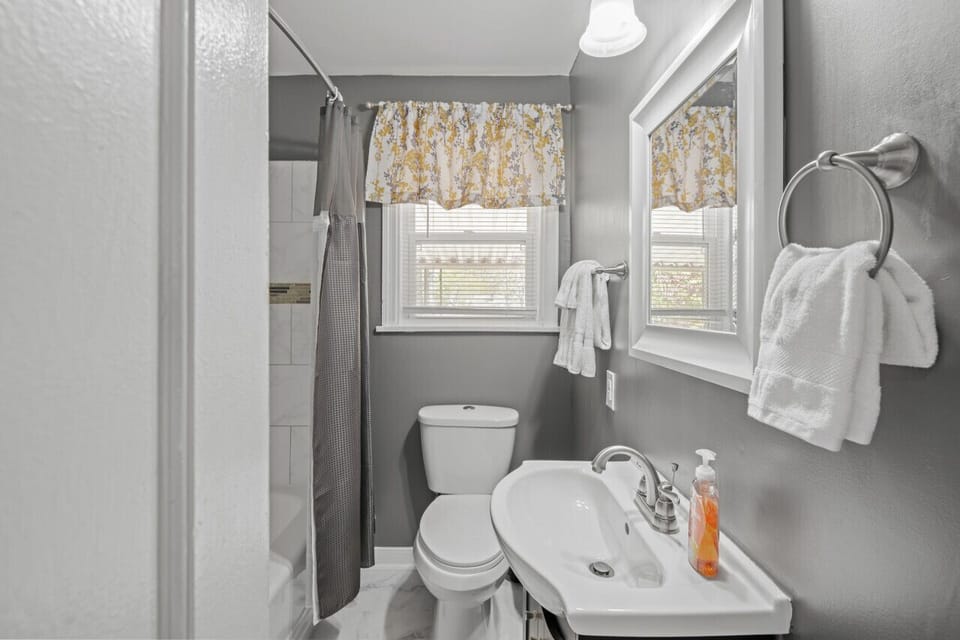 Convenient and stylish, this bath/shower combo features a vanity mirror—your go-to spot to freshen up on the first floor.