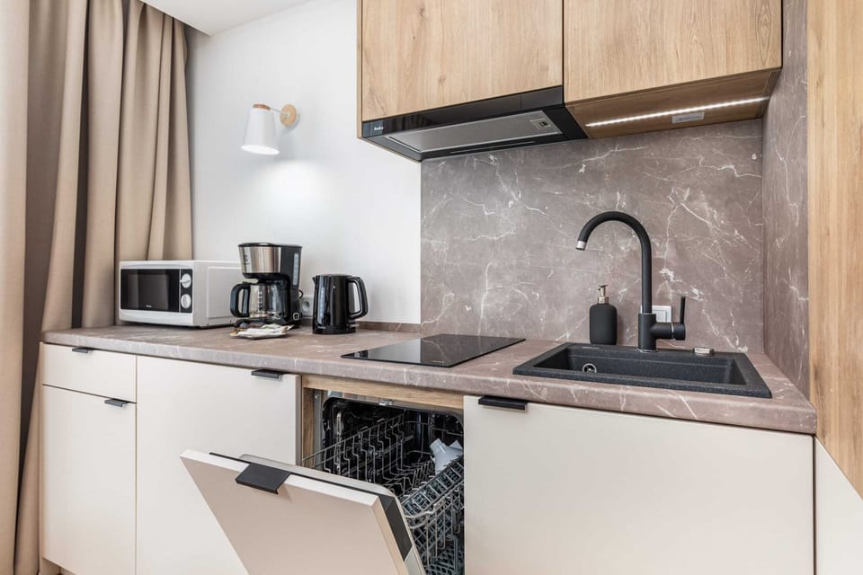 Bright kitchen with quality appliances that allow you to prepare home-cooked meals.