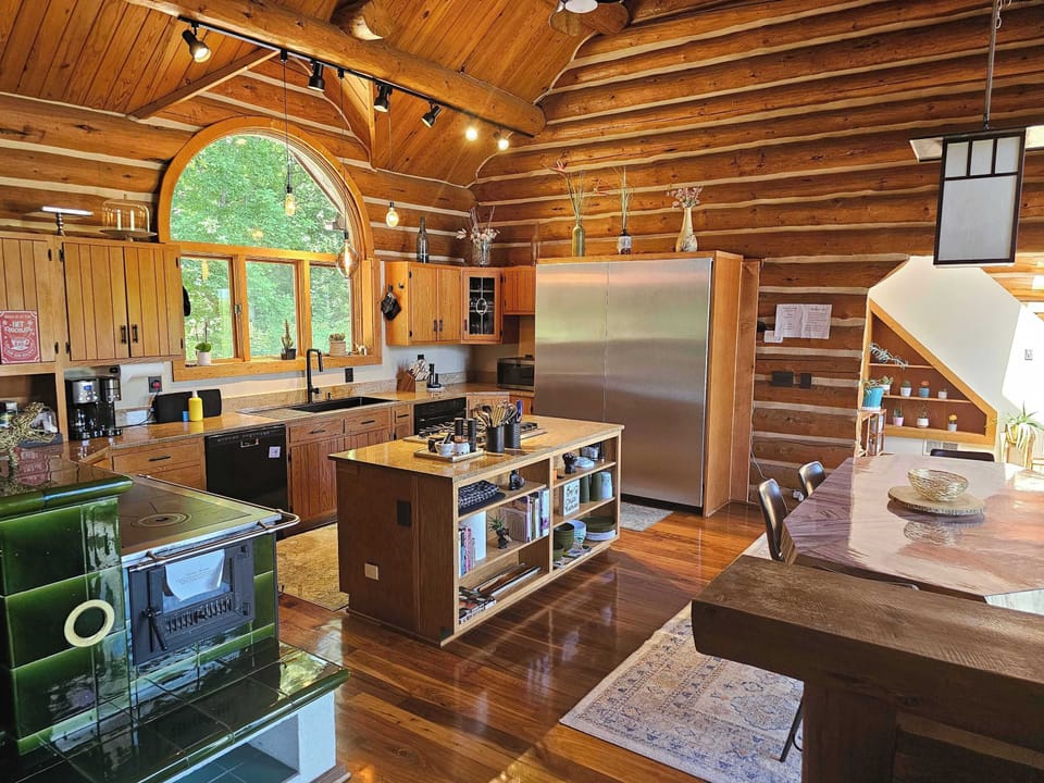 Welcome to your cooking retreat - Thermador Column Fridge and Freezer, Gas Stove, Huge Kitchen Sink, Coffee and Hot Coco Station and an Austrian Tile Stove