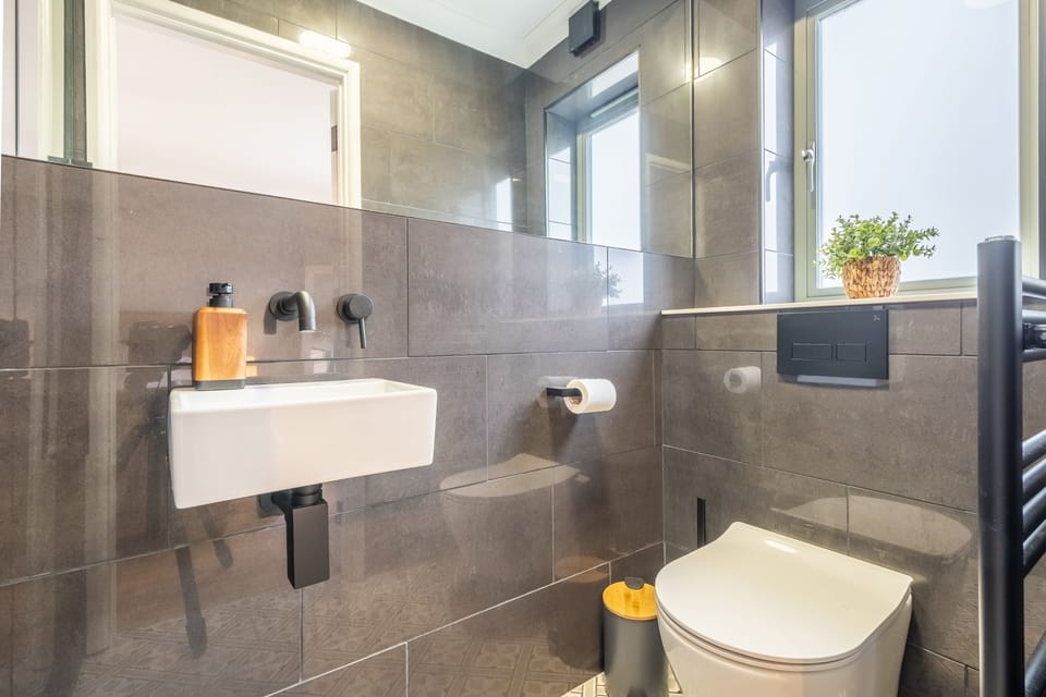 Ground floor: Master en-suite with shower, wash basin and WC