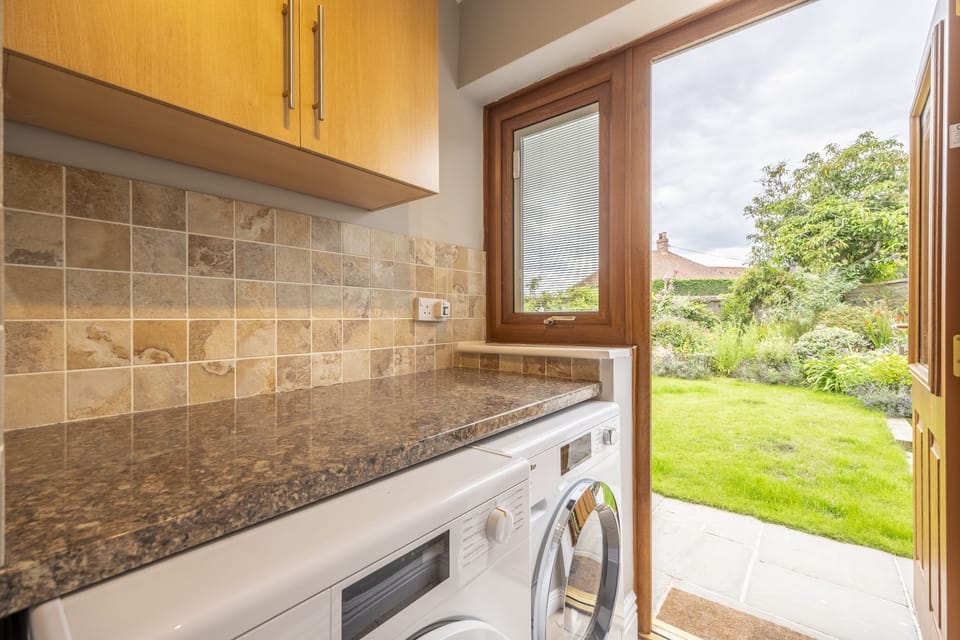 Ground floor: Utility room leading to the back garden