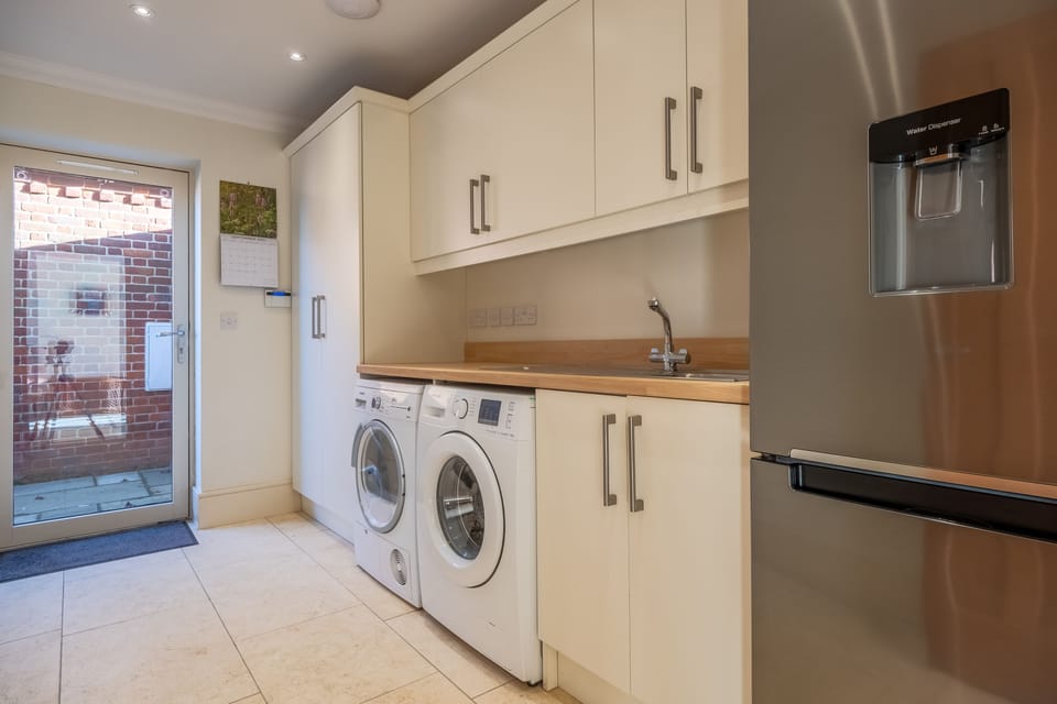 Ground floor: Utility with door to the driveway