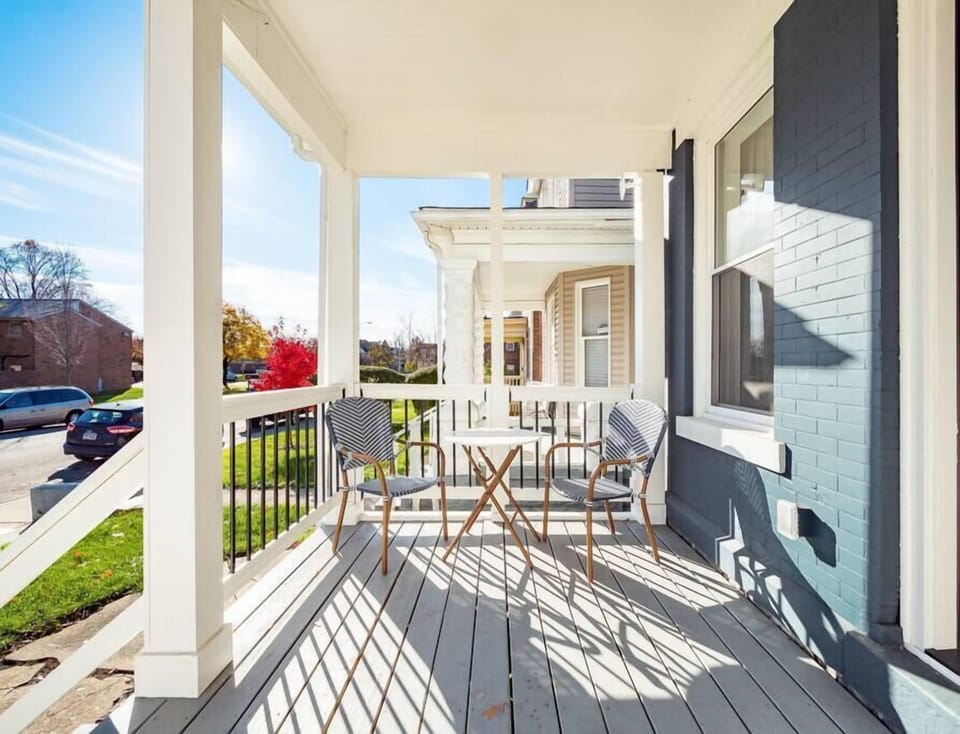 Charming front porch with cozy seating perfect for morning coffee.