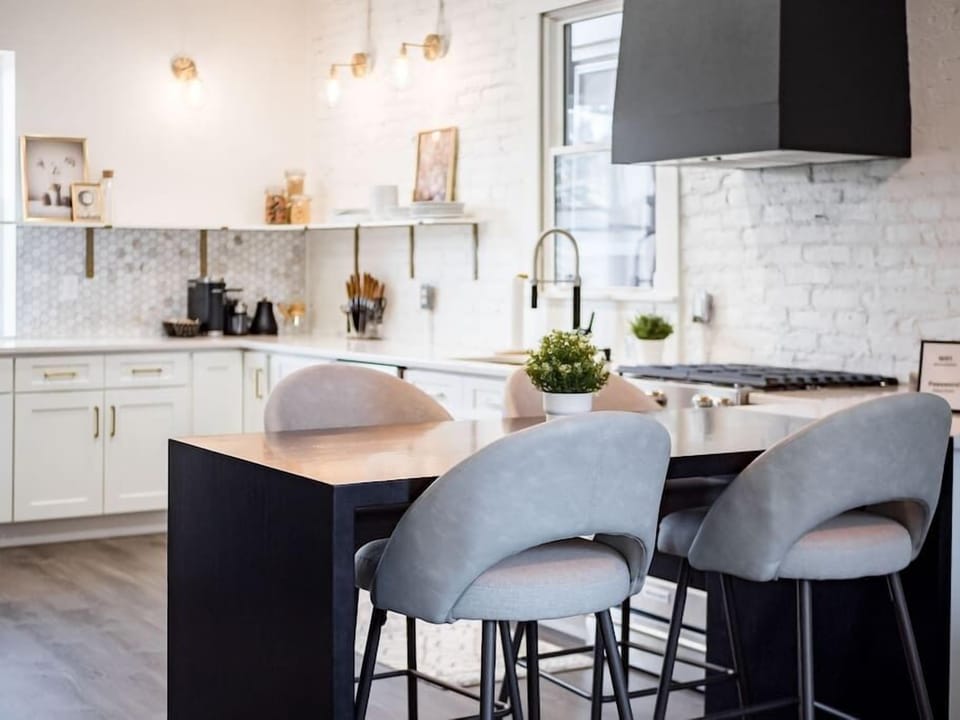 Contemporary kitchen with sleek countertops and a minimalist aesthetic. 