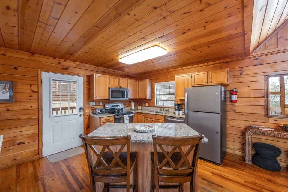 Island seating with 2 chairs in kitchen area